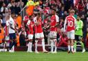 Arsenal's Martin Odegaard looks dejected after the North London derby