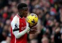 Eddie Nketiah celebrates with the match ball