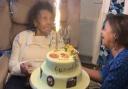 Gwendolyn and her niece  Beverley Chung, who made the cake, which features edible photos on top and around the cake depicting different decades in Gwendolyn's life from age 16