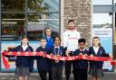 Team GB athlete Morgan Bolding and Aldi Holloway Road store manager Nadya Zhegova cut the ribbon with children from Sacred Heart Catholic Primary School