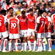 Arsenal players huddle before their match against Fulham