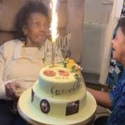 Gwendolyn and her niece  Beverley Chung, who made the cake, which features edible photos on top and around the cake depicting different decades in Gwendolyn's life from age 16