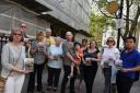 Anger: �Leora �Penchina �(third� right), �George�Devonport �(fourth� left) �and �Dan �Neidle �(holding� child)�with �fellow �protesters�� outside� the �Old �Sessions �House� on �Sunday.� In �the �backg