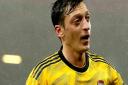 Arsenal's Mesut Ozil gestures to the fans during the Premier League match at the Vitality Stadium, Bournemouth. Picture: Mark Kerton/PA