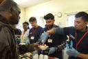 Volunteers from Tesco prepare and serve food on a Sunday afternoon at Storehouse. Picture: Polly Hancock