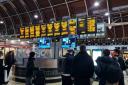 Stock image of commuters waiting for train