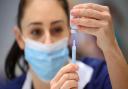 Medical staff preparing shots of a Covid-19 vaccine