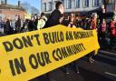 People marching along Fore Street in a protest against the Edmonton Incinerator