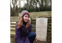 Reporter Beth Wyatt at the grave of her great-great uncle Sidney Stone, in the Somme. Picture: Erica Spurrier/Equity