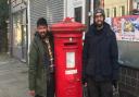 Tara and Ammar from Highgate Stationers next to the post box in the High Street