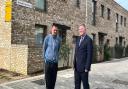 Islington resident John Lowe and Cllr Ward with some of the newly built council housing at Dover Court