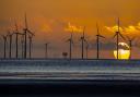 A wind farm in north west England. Climate change should be treated as an emergency in the same way as the Covid-19 pandemic, according a study from the Glasgow Caledonian University Centre for Climate Justice published in July