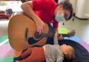 Isabella enjoying a music therapy session