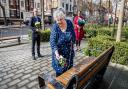 Councillors put down flowers outside the Town Hall. From left: Cllr Richard Watts, Cllr Sue Lukes, and Cllr Kaya Comer-Schwartz