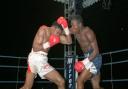 Chris Eubank lands a punch to Michael Watson's head during their WBO title fight at Tottenham's White Hart Lane ground in London.