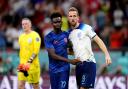 Bukayo Saka congratulates Harry Kane after England's win over Wales