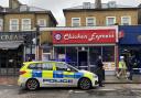 A police cordon was still in place outside Chicken Express in Seven Sisters Road at 1pm today (December 10)