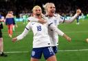 Chloe Kelly and Alex Greenwood celebrate England's win