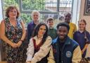 Singer Mae Muller and guitarist Aaron Forbes with (back row, left to right) Principal Emma Gowers, Eleanor, Lucian, Eli and Megan