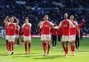 Arsenal players toast their north London derby win