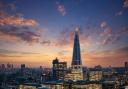 Tower Bridge and the skyline of London, just after sunset