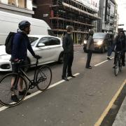 Campaigners - pictured during a 'human bike lane' protest earlier this year - have long said the Old Street corridor is too dangerous for cyclists. It is hoped the new measures will address this. Picture: Tabitha Tanqueray