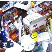 Derryck John lifts his helmet and give away his identity in the Texaco garage in Mare Street