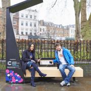 Happier times: Cllr Claudia Webbe tests out one of the smart benches near Islington Green in January. Picture: Simon Way