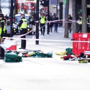 Police officers at the scene after three people were taken to hospital following reports of stabbings at Bishopsgate on October 6