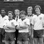 Viv Anderson (left), with Kenny Sansom, Bobby Robson, Peter Beardsley, Chris Woods and Tony Adams at an England photo-call in 1987