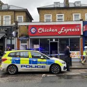 A police cordon was still in place outside Chicken Express in Seven Sisters Road at 1pm today (December 10)