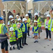 Beats the classroom... children get lesson on building site