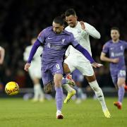 Arsenal's Ben White battles for the ball with Liverpool's Darwin Nunez