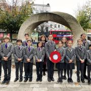 The Gower School's Year 6 children in front of Islington Green War Memorial