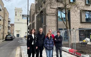 Anton Tol (second from left) and neighbours in front of the new hospital building