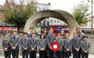 The Gower School's Year 6 children in front of Islington Green War Memorial